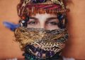 shallow focus photography of woman covered of accessories