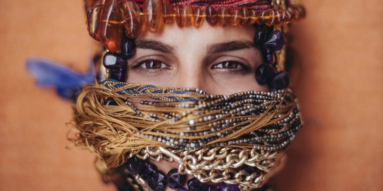 shallow focus photography of woman covered of accessories