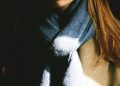 woman wearing brown top and black scarf