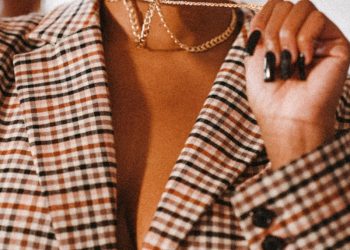 woman in white and black checkered button up shirt